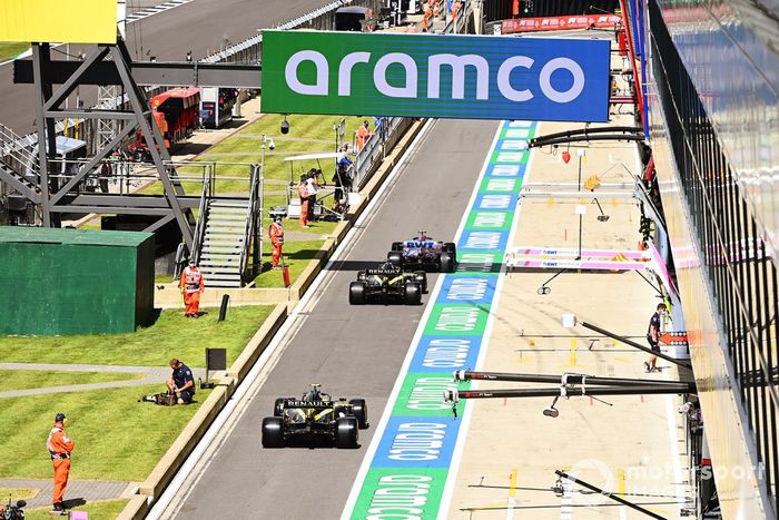Lance Stroll, Racing Point RP20, Daniel Ricciardo, Renault F1 Team R.S.20, and Esteban Ocon, Renault F1 Team R.S.20, in the pit lane