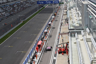 Esteban Ocon, Racing Point Force India VJM11 and Kimi Raikkonen, Ferrari SF71H in pit lane