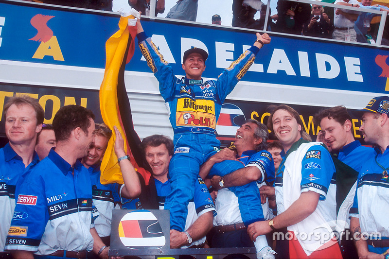 World Champion Michael Schumacher celebrates the Benetton team, Tom Walkinshaw and Flavio Briatore