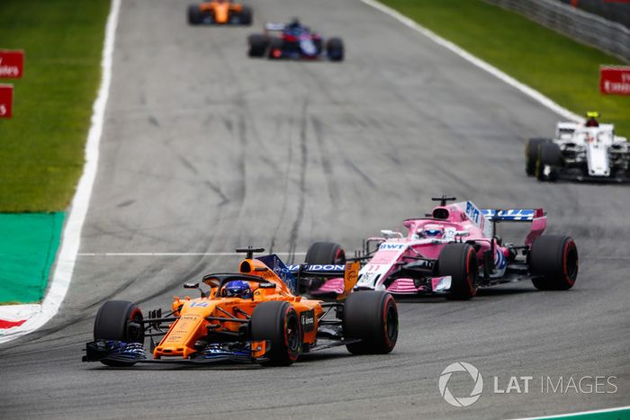 Fernando Alonso, McLaren MCL33, leads Sergio Perez, Racing Point Force India VJM11, and Charles Leclerc, Sauber C37