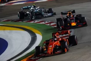 Sebastian Vettel, Ferrari SF90, leads Max Verstappen, Red Bull Racing RB15, and Valtteri Bottas, Mercedes AMG W10