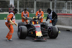 The damaged car of Daniel Ricciardo, Red Bull Racing is recovered by the marshals