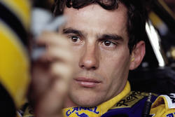 Ayrton Senna strapped to his Lotus cockpit