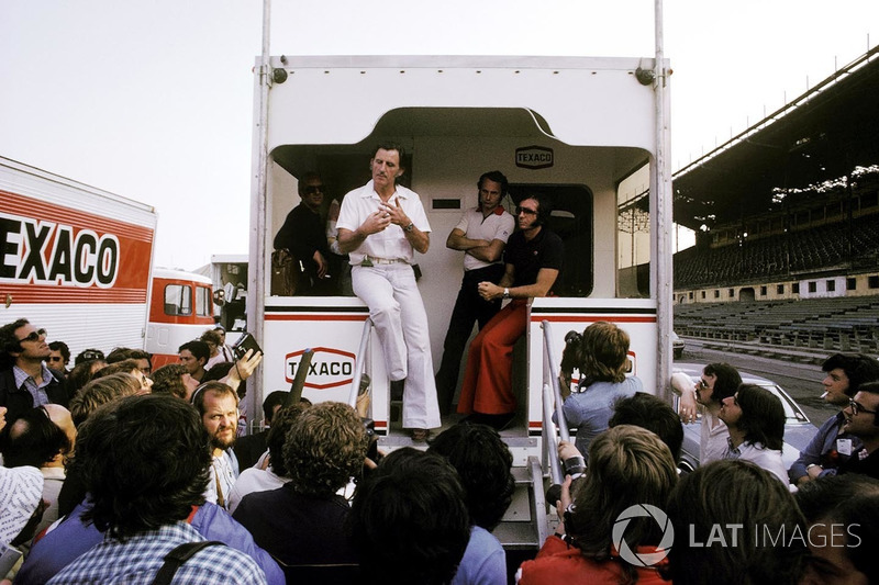 Graham Hill, Hill Team Owner, as a GPDA representative, explains from the back of the McLaren motorhome on the Friday of the meeting, the drivers decision to strike over the poor condition of the guardrail lining the street circuit