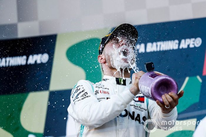 Valtteri Bottas, Mercedes AMG F1, 1st position, drinks Champagne on the podium