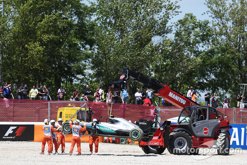 The Mercedes AMG F1 W07 Hybrid of race retiree Nico Rosberg, Mercedes AMG F1 is craned away from the gravel trap at the start of the race