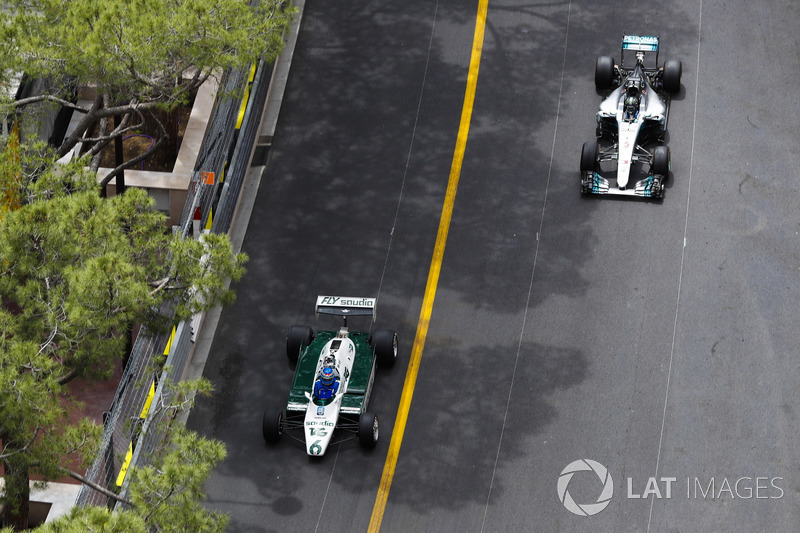 Keke Rosberg leads his son Nico Rosberg as they tour the circuit in their world title winning cars