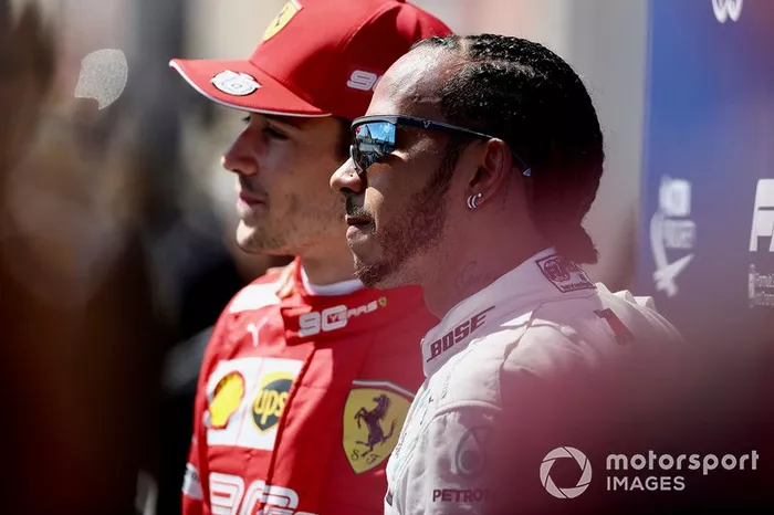 Charles Leclerc, Ferrari,. and pole man Lewis Hamilton, Mercedes AMG F1