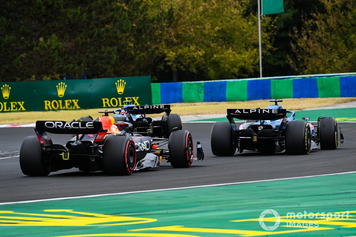 Fernando Alonso tries to keep Max Verstappen behind in Hungary.