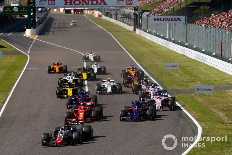 Romain Grosjean, Haas F1 Team VF-18, leads Sebastian Vettel, Ferrari SF71H, Pierre Gasly, Scuderia Toro Rosso STR13, Brendon Hartley, Toro Rosso STR13, Sergio Perez, Racing Point Force India VJM11, Esteban Ocon, Racing Point Force India VJM11, Carlos Sainz Jr., Renault Sport F1 Team R.S. 18, at the start of the race