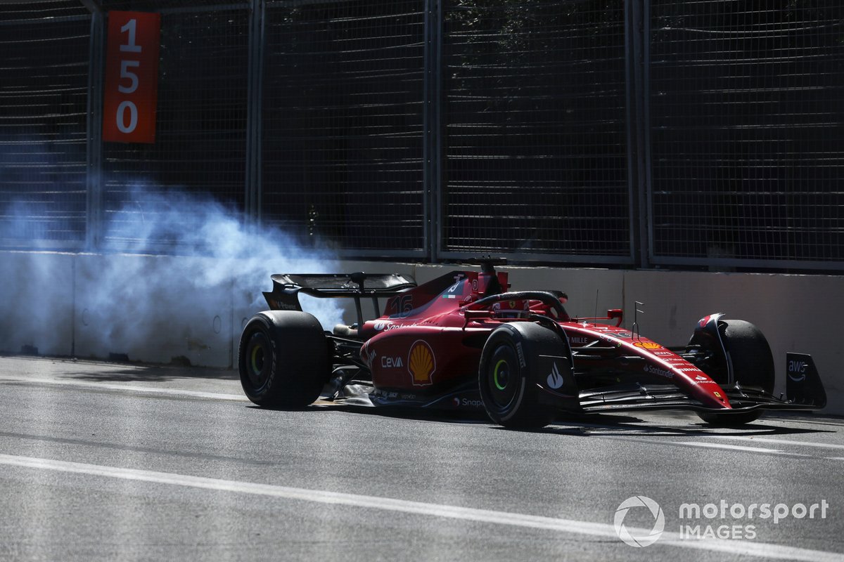 Charles Leclerc, Ferrari F1-75, limps back to the pit trailing smoke