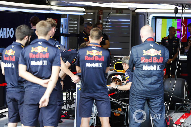 Pierre Gasly, Toro Rosso, sits in a Red Bull Racing RB14