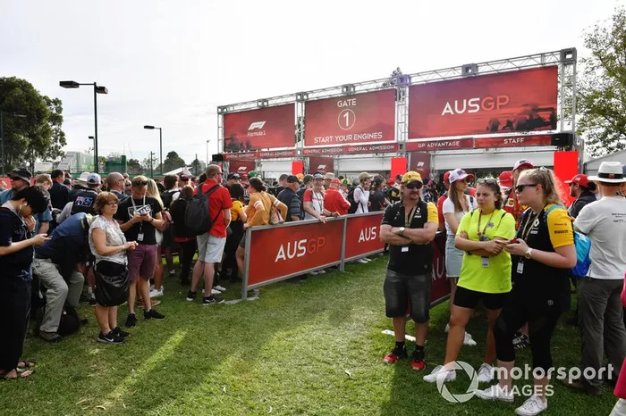 Fans queue at the delayed opening gates