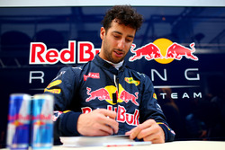 Daniel Ricciardo, Red Bull Racing signs autographs for fans outside the garage