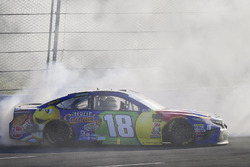 Kyle Busch, Joe Gibbs Racing, Toyota Camry M&M's Caramel celebrates with a burnout after winning