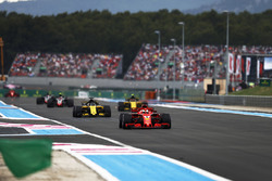 Sebastian Vettel, Ferrari SF71H, leads Nico Hulkenberg, Renault Sport F1 Team R.S. 18, and Carlos Sainz Jr., Renault Sport F1 Team R.S. 18