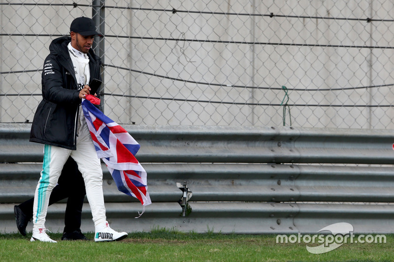 Lewis Hamilton, Mercedes AMG, takes to the track to entertain the fans and picks up a Union Flag