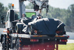 The McLaren MCL32 of Fernando Alonso is recovered back to the pits