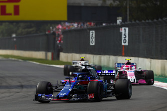 Brendon Hartley, Toro Rosso STR13, leads Esteban Ocon, Racing Point Force India VJM11, and Charles Leclerc, Sauber C37