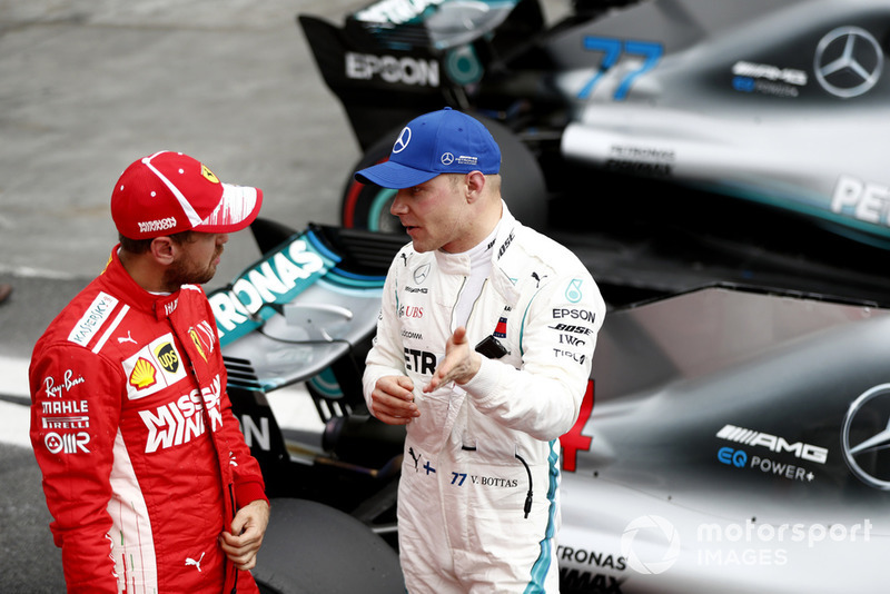 Обладатель второго места в квалификации Себастьян Феттель, Ferrari, третье место – Валттери Боттас, Mercedes AMG F1