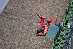 Charles Leclerc, Ferrari, climbs out of his car after crashing out