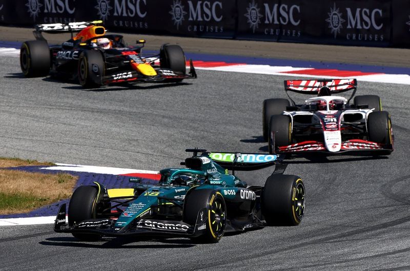 Lance Stroll, Aston Martin Racing, Esteban Ocon, Haas F1 Team