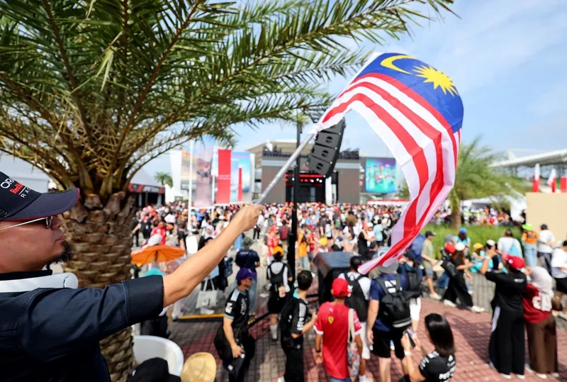 Fan waves Malaysian flag