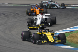 Carlos Sainz Jr., Renault Sport F1 Team R.S. 18, leads Charles Leclerc, Sauber C37, and Fernando Alonso, McLaren MCL33