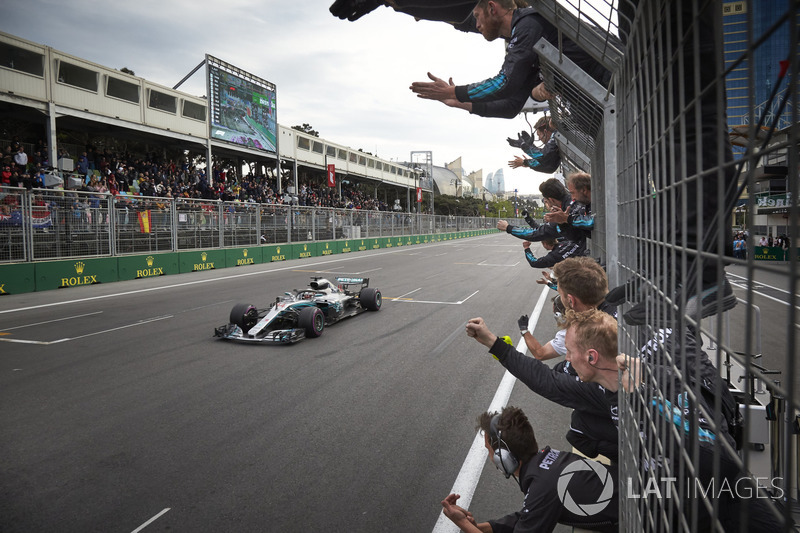 Lewis Hamilton, Mercedes AMG F1 W09, crosses the line for victory to the delight of his team