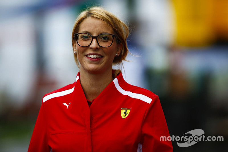 A Ferrari team member in the paddock