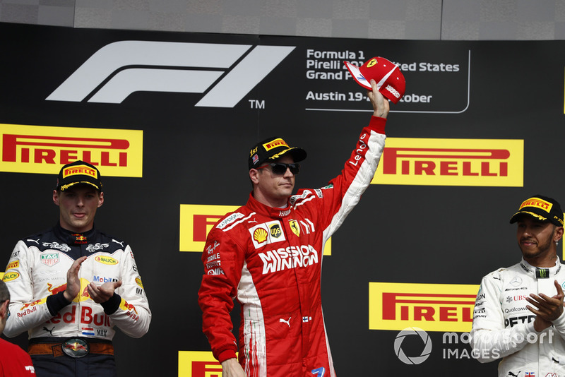 Max Verstappen, Red Bull Racing, 2nd position, and Lewis Hamilton, Mercedes AMG F1, 3rd position, applaud as Kimi Raikkonen, Ferrari, 1st position, celebrates victory