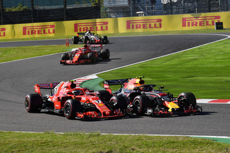 Kimi Raikkonen, Ferrari SF71H and Max Verstappen, Red Bull Racing RB14