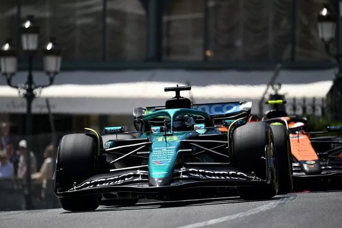 Lando Norris, McLaren, Lance Stroll, Aston Martin Racing
