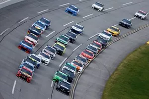 Denny Hamlin, Joe Gibbs Racing, Toyota Camry and Martin Truex Jr., Joe Gibbs Racing, Toyota Camry lead the field at the race start
