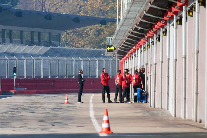 Cadillac Racing team members in the pitlane