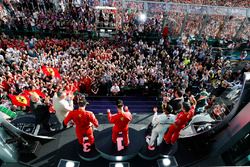 Sebastian Vettel, Ferrari, celebrates victory on the podium with Lewis Hamilton, Mercedes AMG F1, an