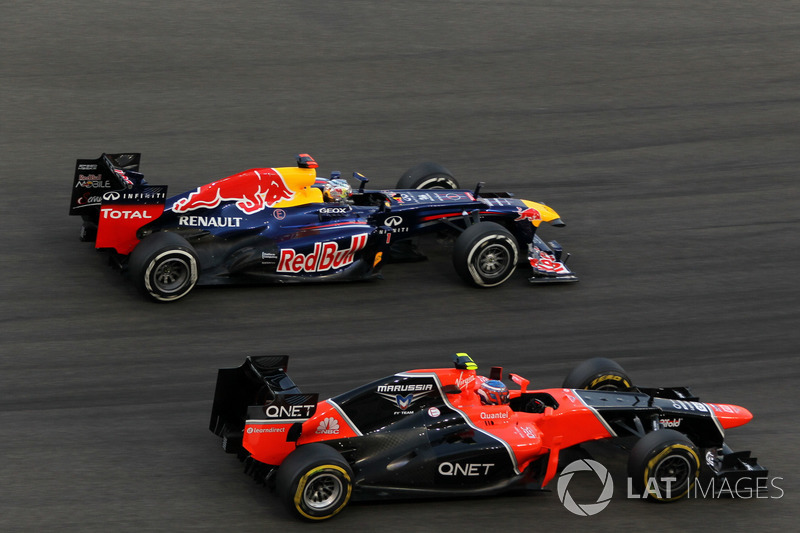 Sebastian Vettel, Red Bull Racing RB8 passes Charles Pic, Marussia F1 Team MR01