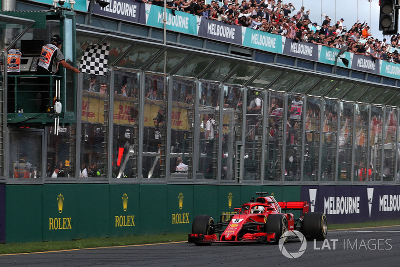 Race winner Sebastian Vettel, Ferrari SF71H crosses the line and takes the chequered flag