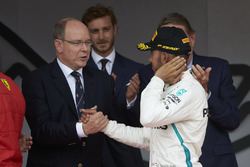 Prince Albert of Monaco greets Lewis Hamilton, Mercedes AMG F1, on the podium