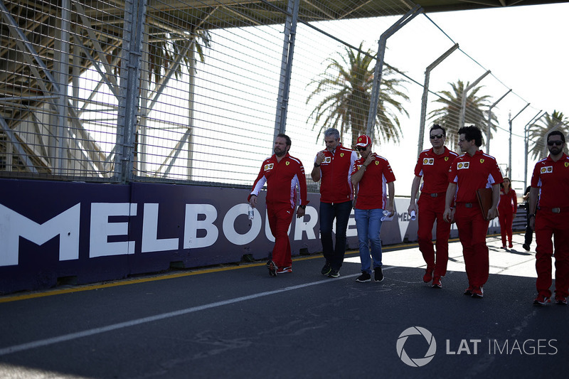 Sebastian Vettel, Ferrari and Maurizio Arrivabene, Ferrari Team Principal walk the track