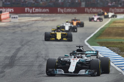 Lewis Hamilton, Mercedes AMG F1 W09, leads Carlos Sainz Jr., Renault Sport F1 Team R.S. 18