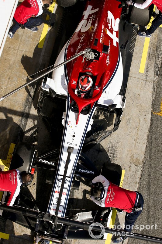 Kimi Raikkonen, Alfa Romeo Racing, stops in his pit area