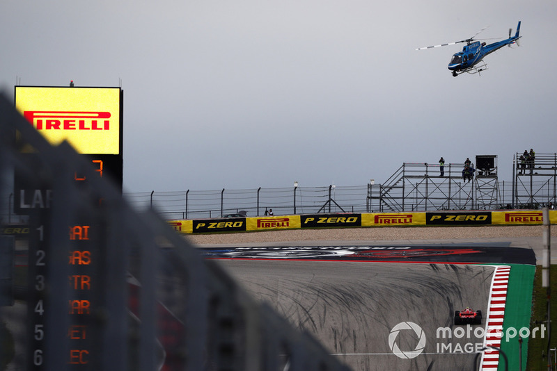 The TV helicopter hovers above Kimi Raikkonen, Ferrari SF71H