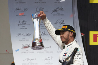 Lewis Hamilton, Mercedes AMG F1, 3rd position, on the podium with his trophy and Champagne