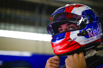Pierre Gasly, Toro Rosso, adjusts his helmet
