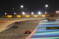 Sebastian Vettel, Ferrari SF71H, leads Valtteri Bottas, Mercedes AMG F1 W09, and Kimi Raikkonen, Fer