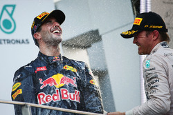 Race winner Daniel Ricciardo, Red Bull Racing celebrates on the podium with third placed Nico Rosberg, Mercedes AMG F1