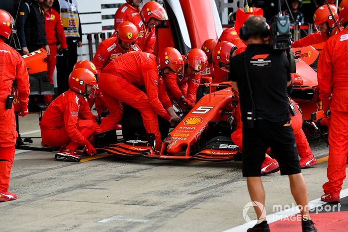 Sebastian Vettel, Ferrari SF90 pit stop for front wing change after contact with Max Verstappen, Red Bull Racing RB15 