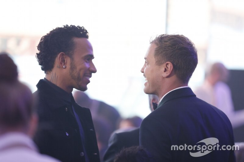 Sebastian Vettel, Ferrari with Lewis Hamilton, Mercedes-AMG F1