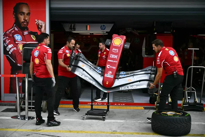 Ferrari team mechanics at work